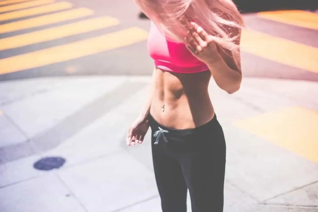 Woman with toned stomach after LA-EMS Body Sculpting Treatment Kenilworth